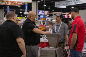 Robb Murray talking with customers at IPPE.